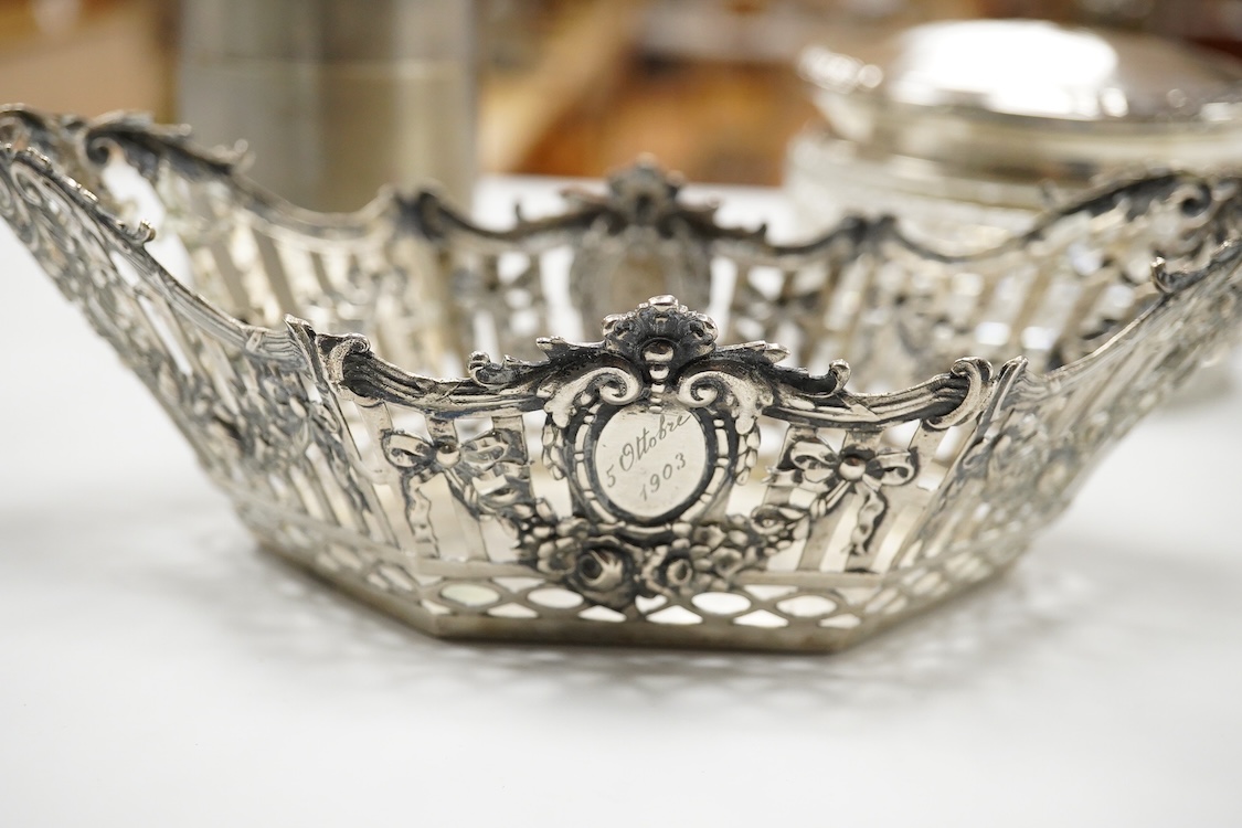 A German pierced 800 standard white metal bowl, 21.2cm, an engine turned white metal cigarette canister and a silver mounted glass dressing table pot.